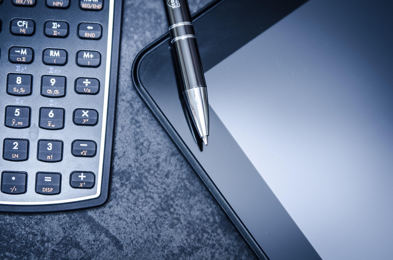 Tablet, calculator, business — How Businesses Benefit from Age Verification Systems for Compliance, Safety, and Customer Conf