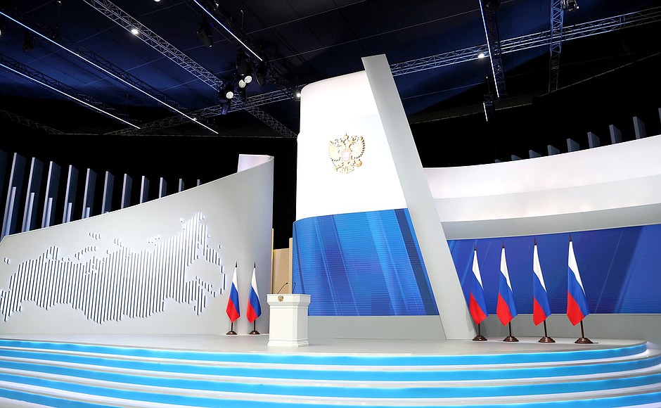 empty podium on a stage with Russian flags