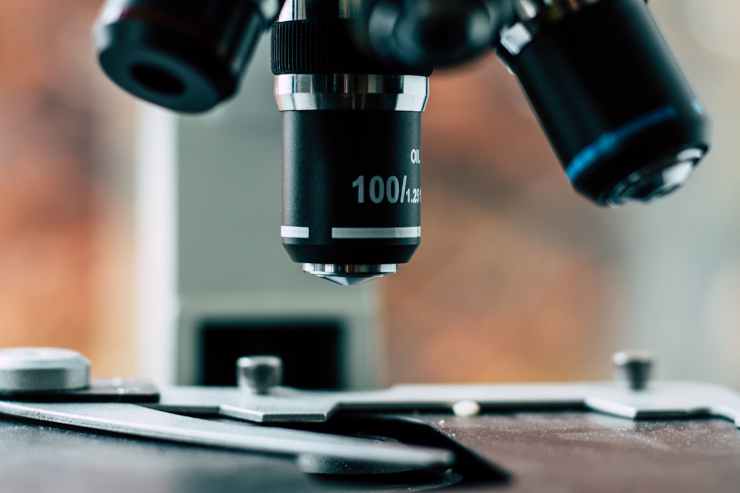 Close-up view of a microscope lens for scientific research